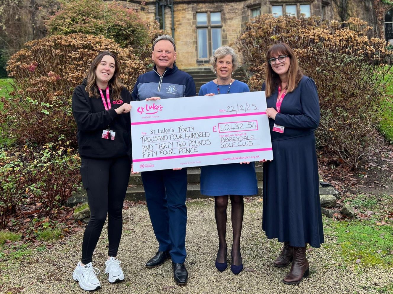 The Abbeydale Golf Club team pictured with Jo Lenton and their cheque for £40,432 to St Luke's Hospice.